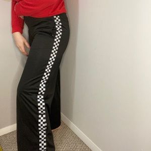 Vans track pants with side buttons.